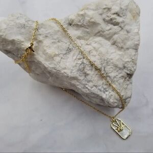 Women’s 18k gold plated evil eye necklace with mother pearl accent.